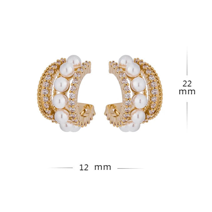 Gold hoop earrings with pearls and measurements on a white background