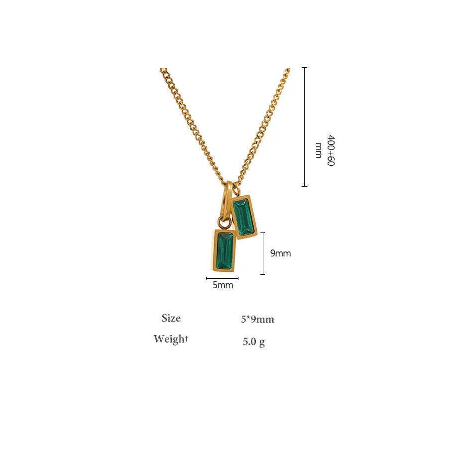Gold necklace with green gemstones and measurements on a white background