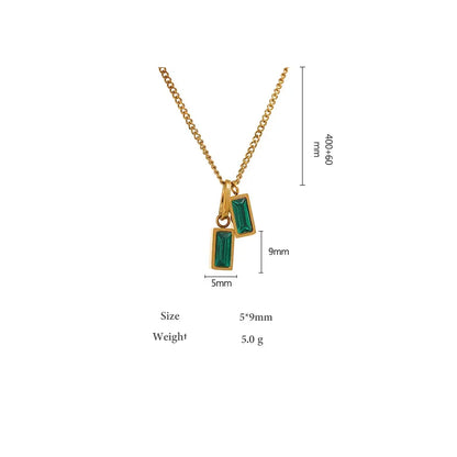 Gold necklace with green gemstones and measurements on a white background