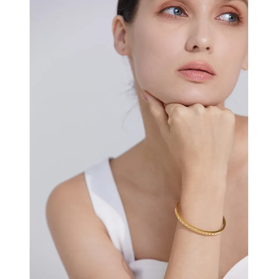 60mm Cast Bangle Bracelet – Gold Plated Stainless Steel with Zirconia