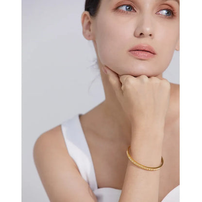 60mm Cast Bangle Bracelet – Gold Plated Stainless Steel with Zirconia