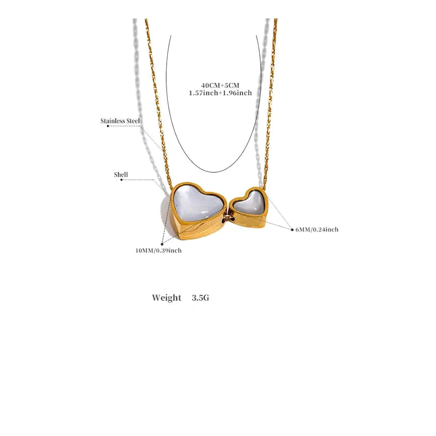 Gold necklace with heart-shaped pendant on a white background