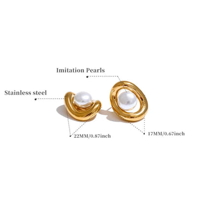 Gold earrings with imitation pearls on a white background