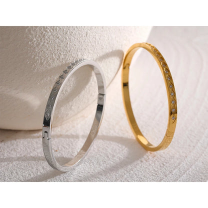 60mm Cast Bangle Bracelet – Gold Plated Stainless Steel with Zirconia