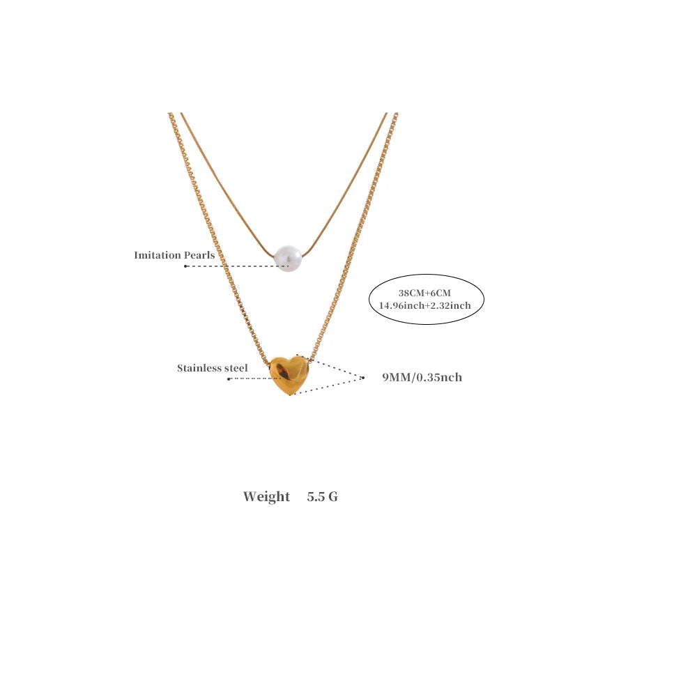 Gold necklace with heart-shaped pendant and measurement details on a white background