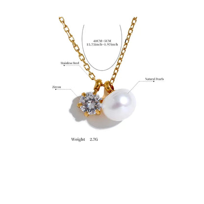 Gold necklace with a pearl and zircon pendant on a white background
