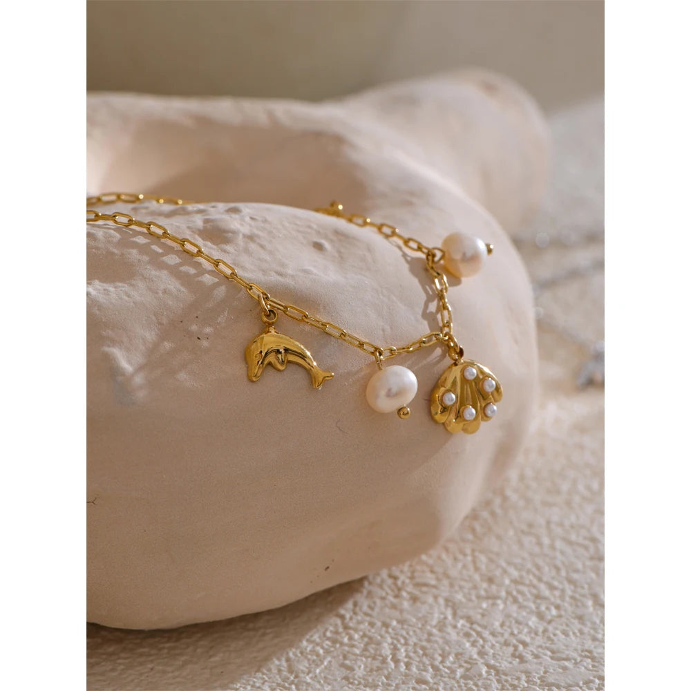 Ocean Charm Pearl Anklet – Shell Dolphin & Conch Design