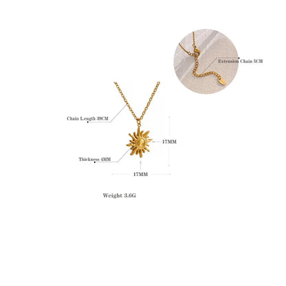 Gold necklace with sun design on a white background